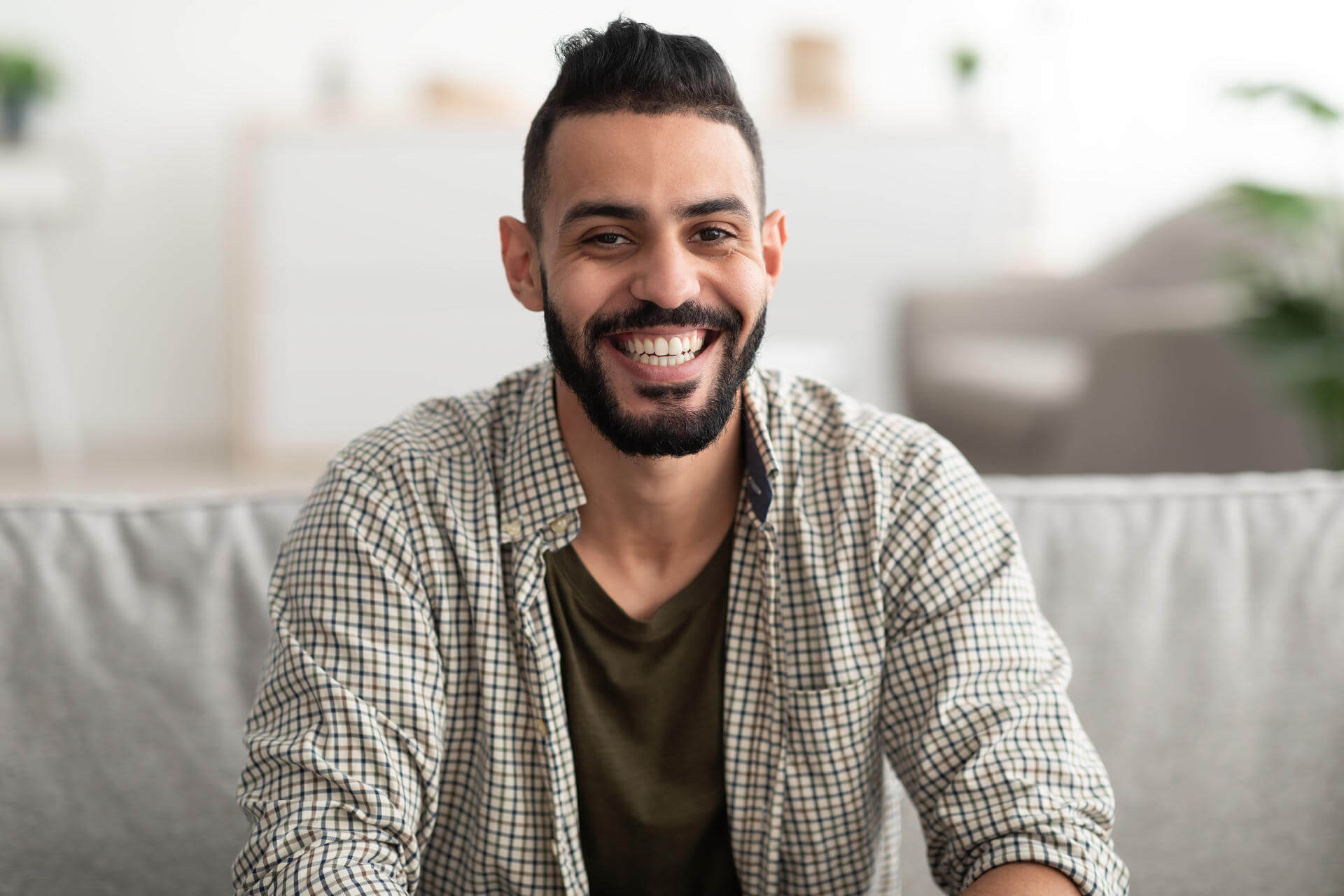 portrait-of-attractive-young-arab-man-smiling-and-2025-03-18-17-26-53-utc.jpg